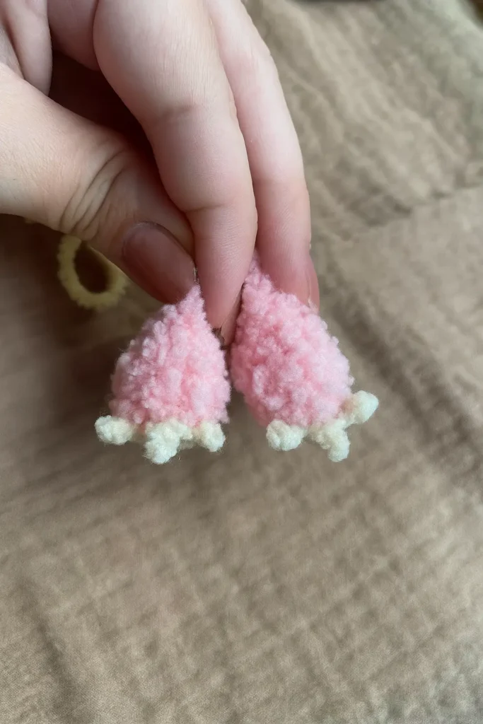 Crochet Labubu legs with pink and beige yarn