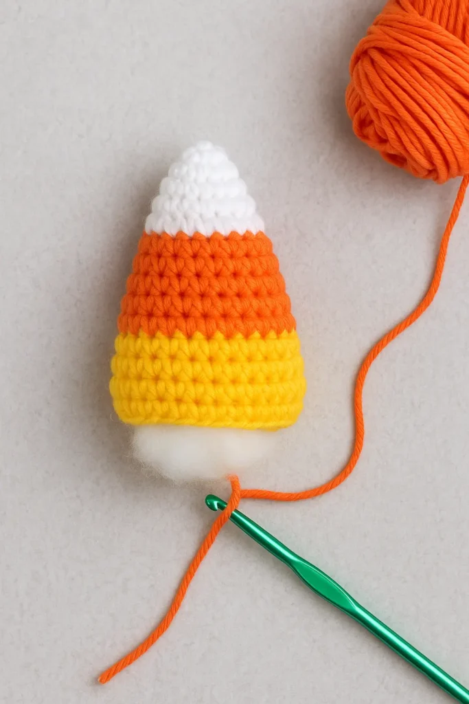 stuffing step in crochet pattern for candy corn before closing