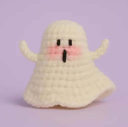 Layered-skirt crochet ghost with long vertical mouth and outer ruffle