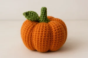 Free Crochet Pumpkin Pattern (MR & Chain) + 7 Easy Variations Ribbed crochet pumpkin with leaf and stem — free crochet pumpkin pattern in mini, medium, and large sizes.