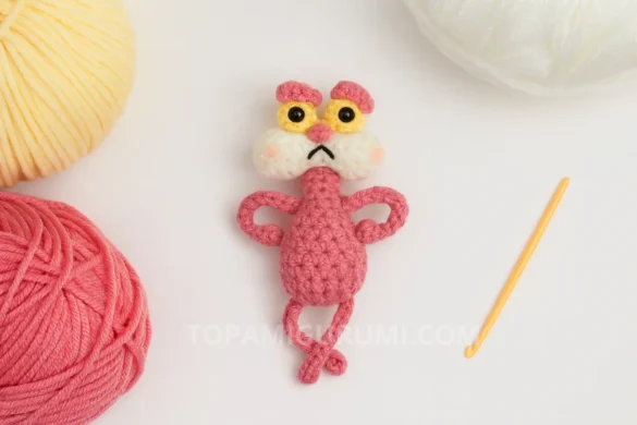 pink cat amigurumi pattern free finished toy on white background with yarn and hook