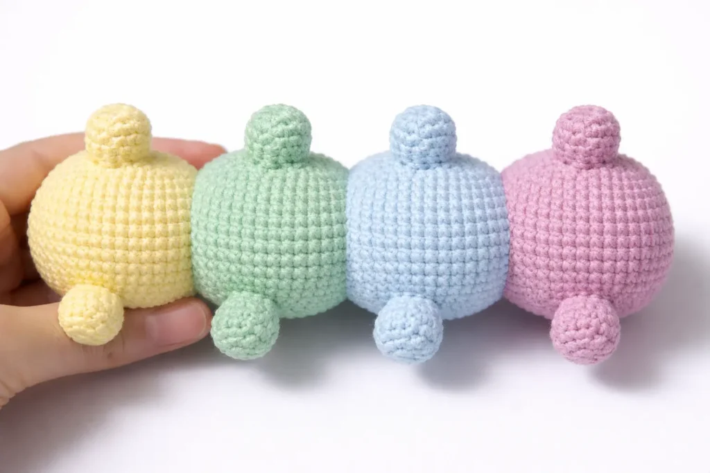 Legs step for pastel caterpillar crochet pattern showing pastel body segments and small crochet legs