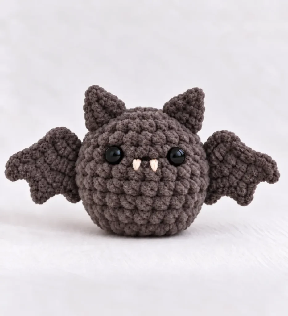 No-sew mini bat crochet pattern made with chunky gray yarn